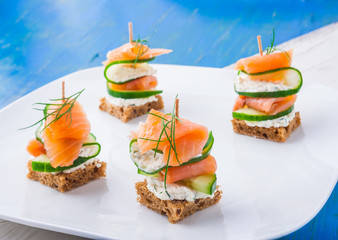 small sandwiches with salmon and cream cheese