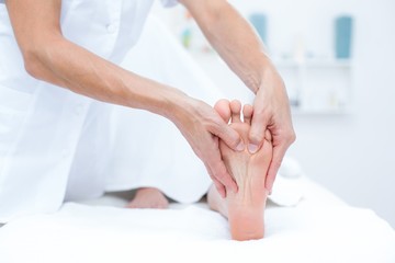 Fototapeta na wymiar Physiotherapist doing foot massage
