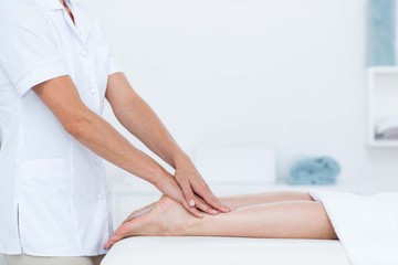 Obraz na płótnie Canvas Physiotherapist doing foot massage