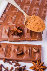 chocolate pieces on white wooden table