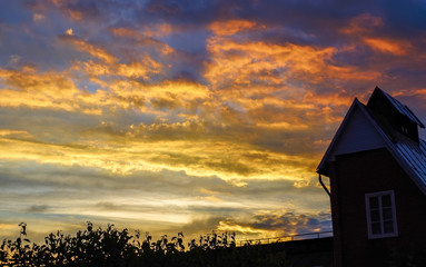 Obraz na płótnie Canvas Landscape of house at sunset