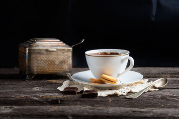 cup of coffee on wood table