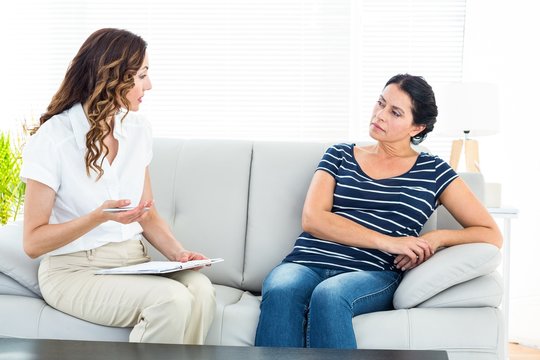 Therapist talking to her patient