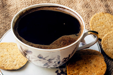 cup of coffee on old wood table