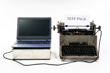 New laptop computer printing page to old vintage typewriter