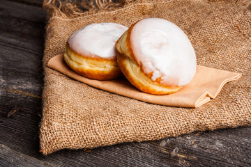 Fresh donuts on wood table