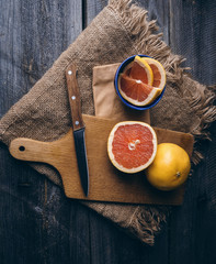 slice of grapefruit on a wooden background