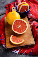 slice of grapefruit on a wooden background