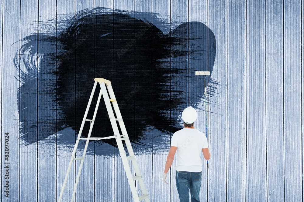 Aufkleber composite image of man with paint roller standing by ladder
