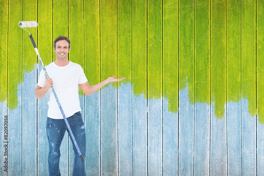 Aufkleber composite image of man gesturing while holding paint roller