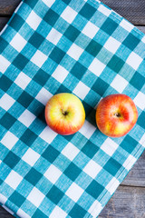 two apples on wooden table