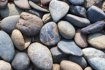 Fototapeta na wymiar Pebbles stone natural background at seashore
