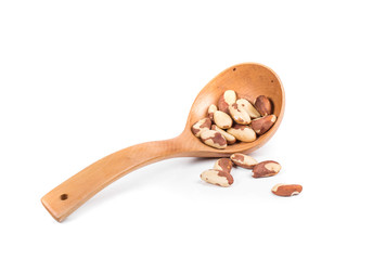 Wooden spoon with brazil nuts.