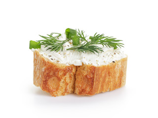 crunchy baguette slice with cream cheese and herbs isolated