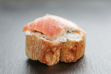 small sandwich with soft cheese and salmon