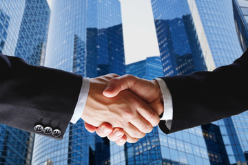 business deal, handshake on modern blue background