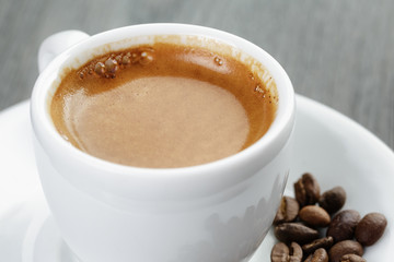 cup of fresh espresso on vintage blue table