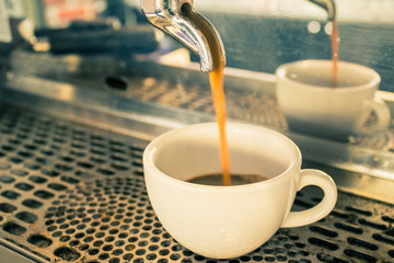 Close up Coffee machine making espresso in a cafe.