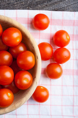 Cherry tomatoes in wooden bowl