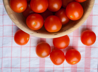 Cherry tomatoes in wooden bowl
