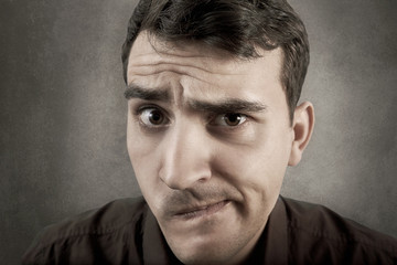 Obraz premium Undecided young student man