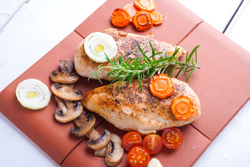 Baked chicken breast with mushrooms and carrots