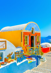 Typical colorful street in Oia of Santorini island in Greece