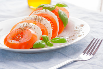 Traditional mozzarella with tomato. Mediterranean salad