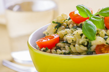 Pasta with spinach and cherry tomatoes.