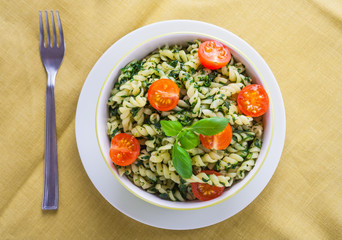 Pasta with spinach and cherry tomatoes.