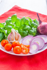 Ingredients for making pesto sauce on the kitchen table