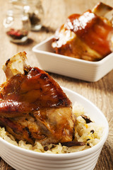 Roast pork knuckle served with boiled cabbage, bread, horseradis