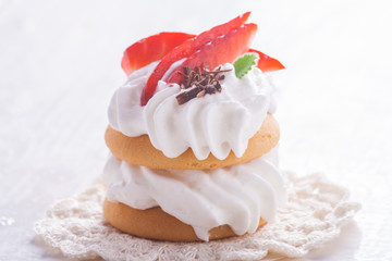Small biscuits with fruits and whipped cream