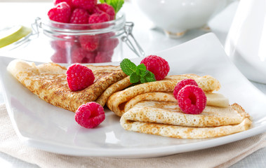 Homemade pancakes with raspberries and mint