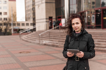 Young woman with Tablet reading