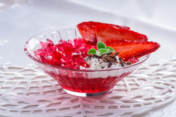 Red jelly with fresh strawberries