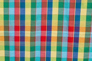 Fabric background cells of red,blue,green and yellow
