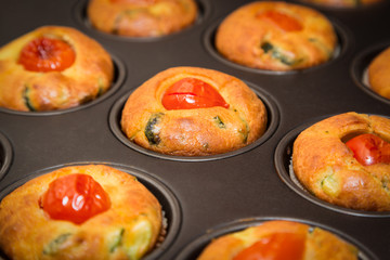 Muffin with zucchini and cherry tomatoes