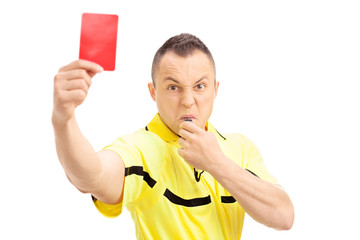 Furious football referee showing a red card