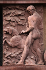 Naklejka premium Naked hunter with a dog.