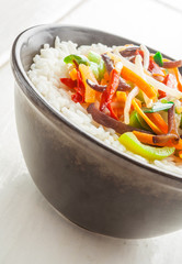 A bowl of rice with vegetables