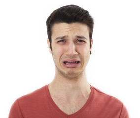 Young sad man crying