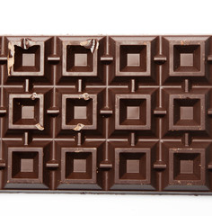 Big plate of dark chocolate on white background