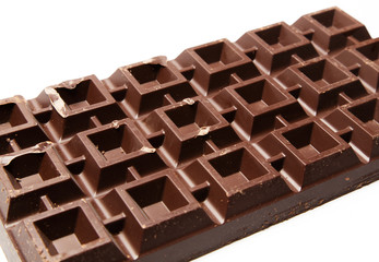 Big plate of dark chocolate on white background
