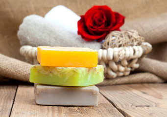 colorful handmade soap bars, on wooden background