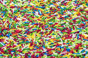 Fototapeta na wymiar Mix of colorful Sugar sticks powder background
