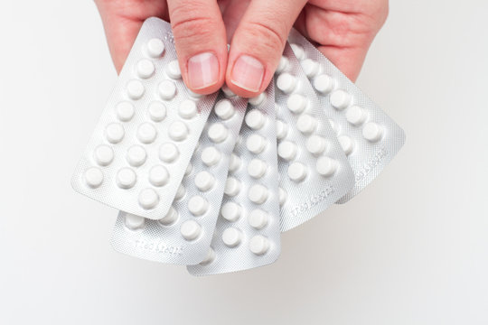 Pills in a blister pack on hands