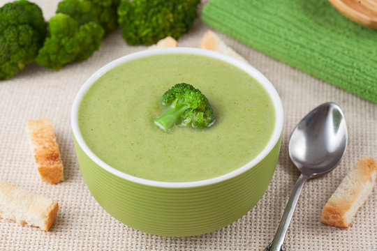 Portion of green broccoli cream soup restaraunt recipe with
