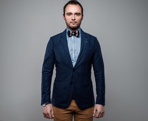 Sharp dressed fashionist wearing jacket and bow tie