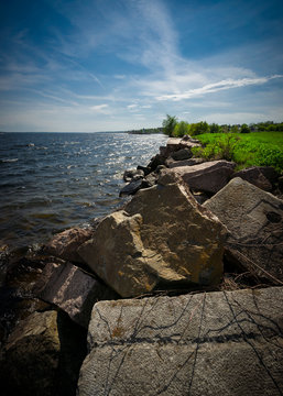 Large boulders line the shores of the St. Lawrence river